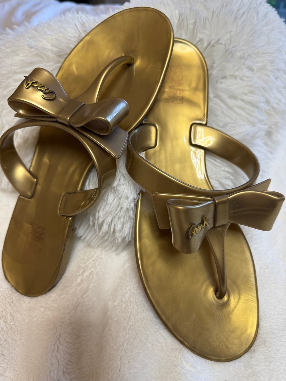 Coach Poppy “Pretty” Metallic Gold Jelly Bow Thong Sandals